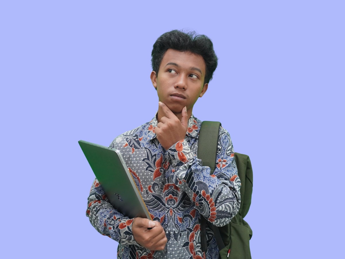 A smiling, confident Malaysian teenager